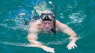 Blue Coral Diving - PADI Dive Center Hoi An Vietnam | Snorkeler gently swimming and making his way back to the dive boat.