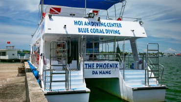 Blue Coral Diving - PADI Dive Center Hoi An Vietnam | Hoi An Diving Center Scuba Boat docked on the river - rear view