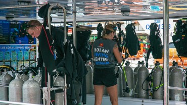 Blue Coral Diving - PADI Dive Center Hoi An Vietnam | Hoi An Diving Center Scuba Boat 2 Staff getting scuba equipment ready.
