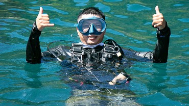 Blue Coral Diving - PADI Dive Center Hoi An Vietnam Happy Scuba Diver at the surface Thumbs Up!