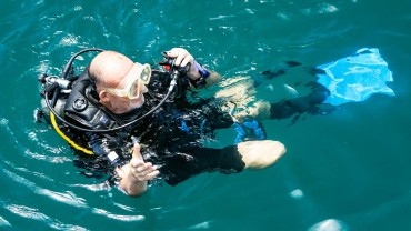 Blue Coral Diving - PADI Dive Center Hoi An Vietnam | Scuba Diver floating at the surface after a nice dive in Hoi An Vietnam.